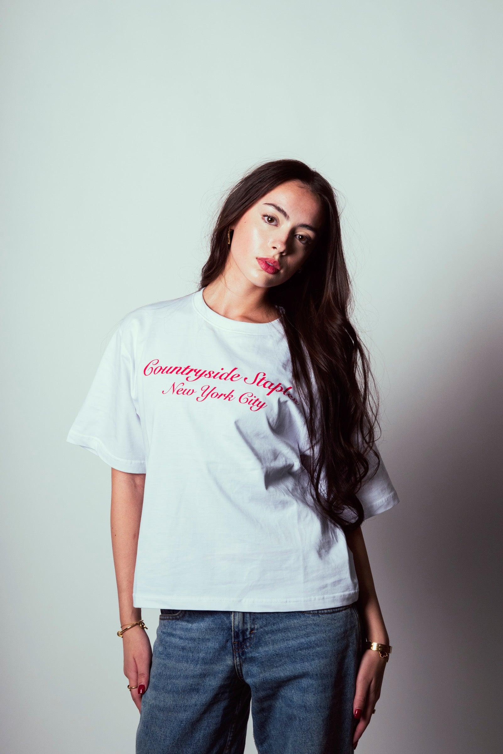 Model wearing Countryside Staples New York City t-shirt with side pose