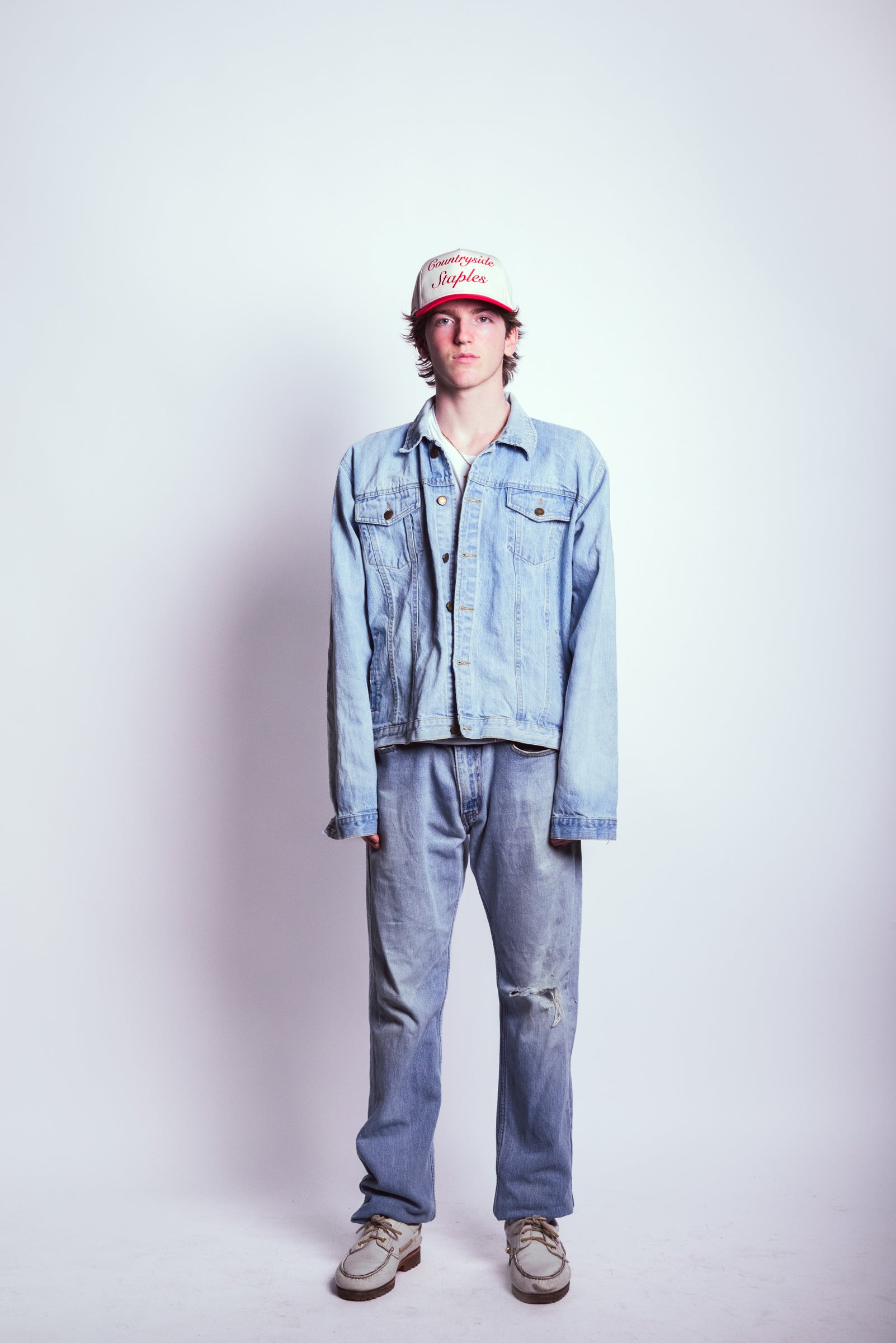 Model wearing Friends and Family Countryside Staples Hat styled with full denim set.