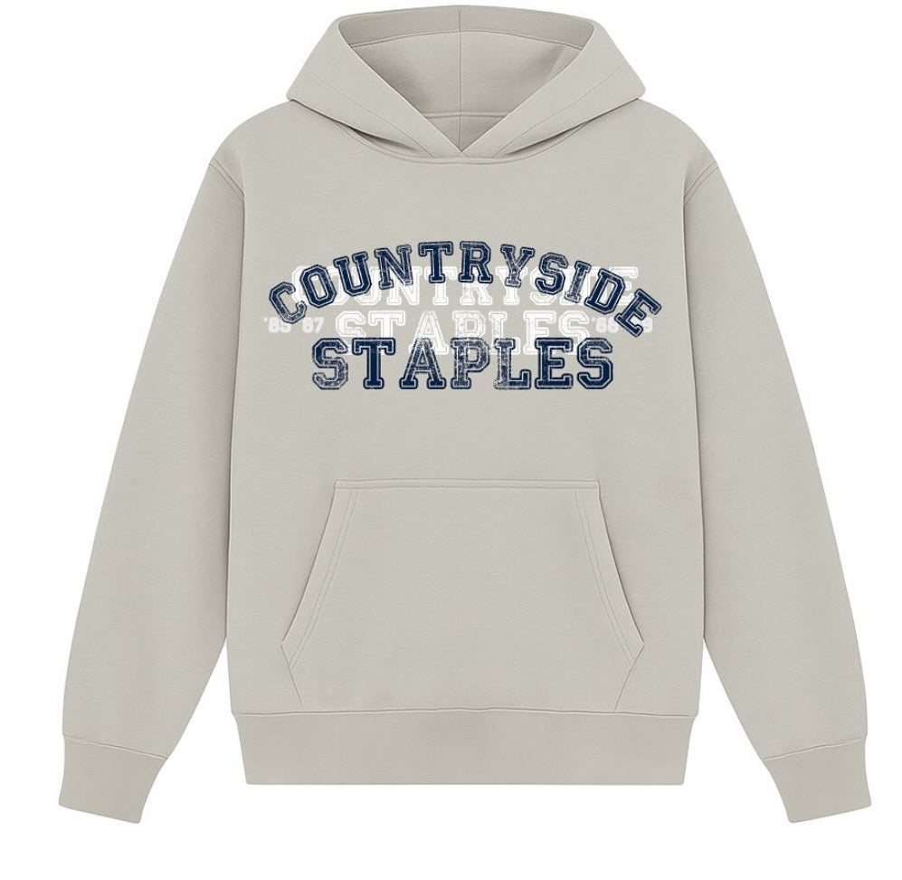 Gray Countryside Staples hoodie laid flat on white background 